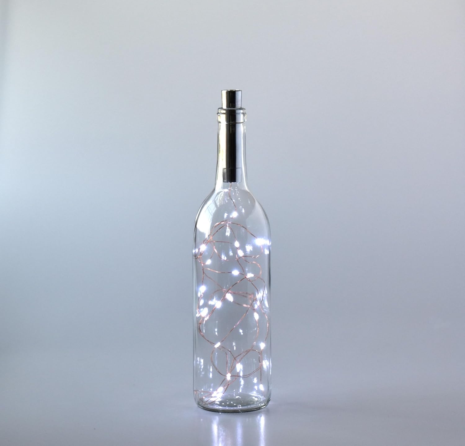 Clear Wine Bottle With Copper Fairy Lights Powered by Cork